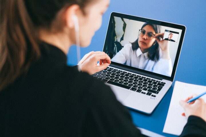 Online video meeting on a laptop screen